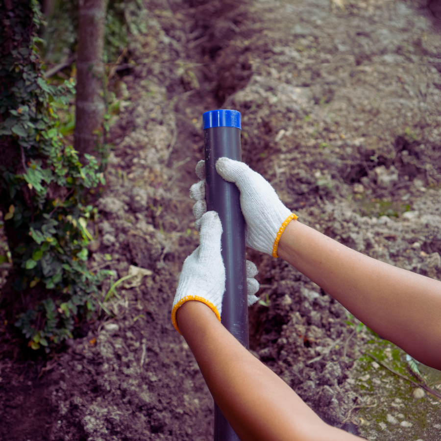 Plumber installing HDPE pipe